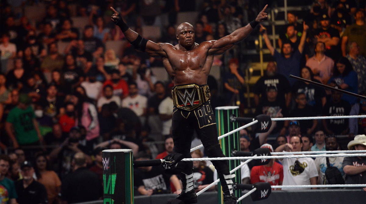 Jul 18, 2021; Fort Worth, TX, USA;Bobby Lashley (black trunks) with MVP (suit) battles Kofi Kingston (purple pants) for the WWE World Heavyweight Championship during Money in the Bank at Dickies Arena.